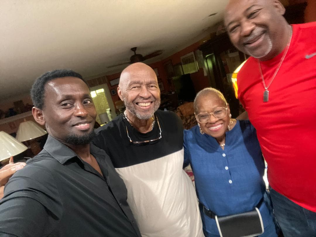 Eddy Kalisa Nyarwaya photographed together with three members of the international advisory